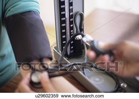 Stock Photo - Blood pressure measurement. Fotosearch