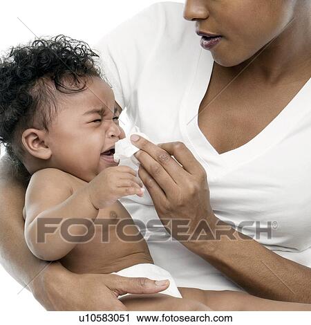 Blowing a baby's nose View Large Photo Image Stock Image - Blowing a baby's nose. Fotosearch