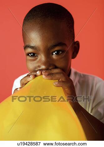 Blowing up a balloon View Large Photo Image Stock Photo - Blowing up a balloon. Fotosearch