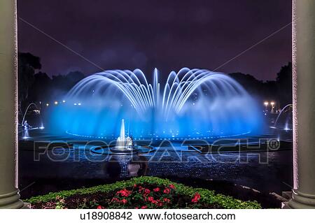 Stock Image - Blue illuminated fountain at night, Park of the Reserve (Parque de la Reserva), Lima, Peru. Fotosearch