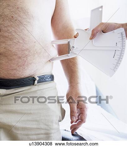 Stock Photo - Body fat assessment. Fotosearch