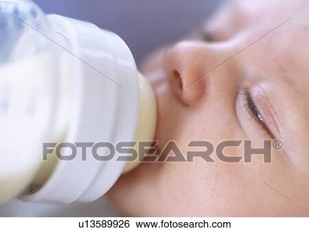 Bottle-feeding baby boy View Large Photo Image Stock Photograph - Bottle-feeding baby boy. Fotosearch
