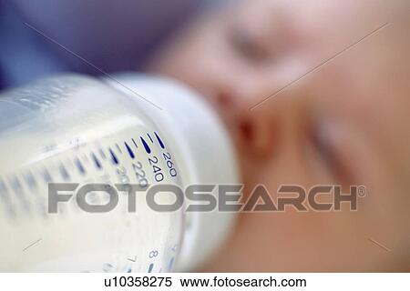 Stock Photography - Bottle-feeding baby. Fotosearch