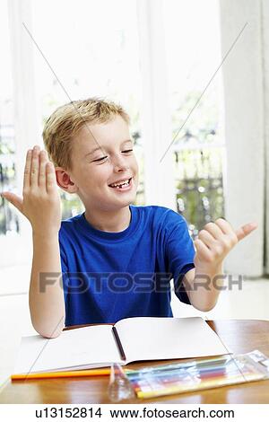 Boy counting on his fingers View Large Photo Image Picture - Boy counting on his fingers. Fotosearch