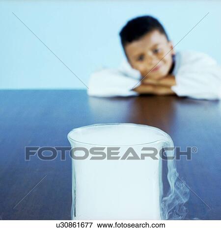 Boy looking at dry ice View Large Photo Image Stock Photo - Boy looking at dry ice. Fotosearch