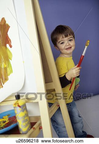 Stock Photo - Boy painting. Fotosearch