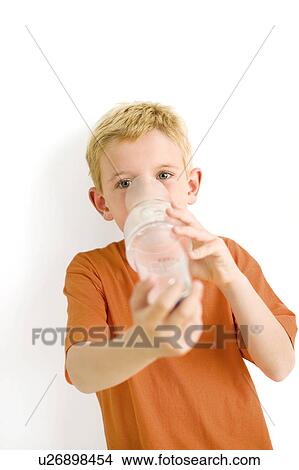 Picture - Boy using an asthma spacer. Fotosearch