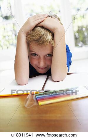 Boy with pens and exercise book View Large Photo Image Stock Image - Boy with pens and exercise book. Fotosearch