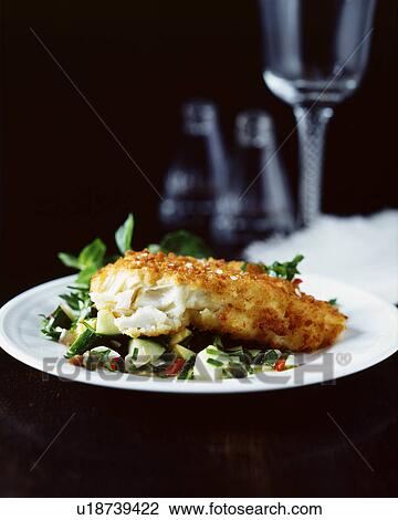 Breaded fish with salad on white plate View Large Photo Image Stock Image - Breaded fish with salad on white plate. Fotosearch