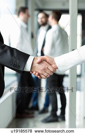 Businessman and businesswoman shaking hands View Large Photo Image Stock Photo - Businessman and businesswoman shaking hands. Fotosearch