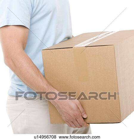 Carrying a box View Large Photo Image Stock Photo - Carrying a box. Fotosearch