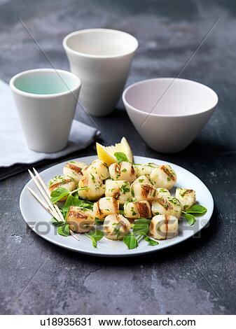 Chargrilled scallops on plate with herbs and lemon slice View Large Photo Image Stock Image - Chargrilled scallops on plate with herbs and lemon slice. Fotosearch