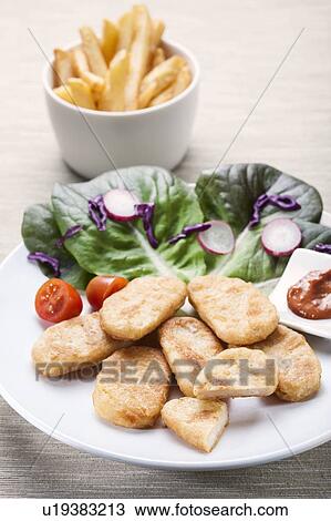 Chicken nuggets and salad View Large Photo Image Stock Image - Chicken nuggets and salad. Fotosearch