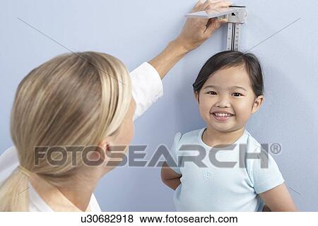 Child height measurement View Large Photo Image Stock Photo - Child height measurement. Fotosearch