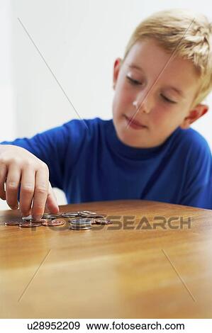 Child with loose change View Large Photo Image Stock Photo - Child with loose change. Fotosearch
