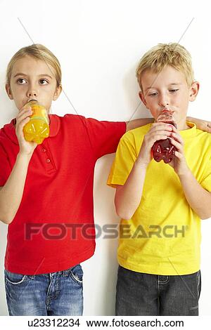Children drinking squash View Large Photo Image Picture - Children drinking squash. Fotosearch