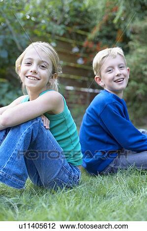 Children sitting in the garden View Large Photo Image Stock Image - Children sitting in the garden. Fotosearch