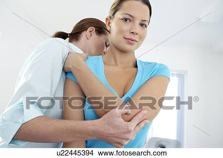 Picture - Chiropractic examination. Fotosearch