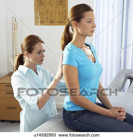 Stock Image - Chiropractic examination. Fotosearch