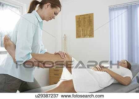 Stock Photo - Chiropractic examination. Fotosearch