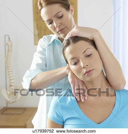 Stock Image - Chiropractic treatment. Fotosearch
