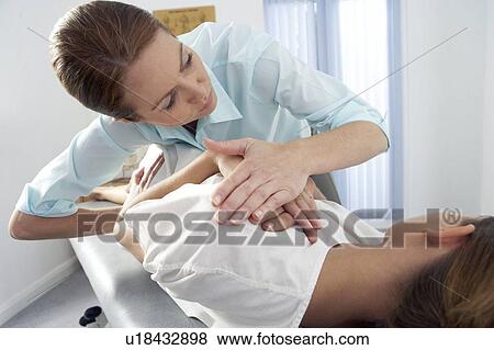 Stock Photo - Chiropractic treatment. Fotosearch