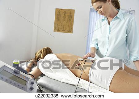 Stock Photography - Chiropractic treatment. Fotosearch
