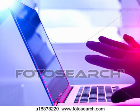 Close up of gloved hand hacking laptop computer View Large Photo Image Stock Image - Close up of gloved hand hacking laptop computer. Fotosearch