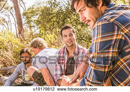 Close up of man with hiking friends in forest, Deer Park, Cape Town, South Africa View Large Photo Image Stock Image - Close up of man with hiking friends in forest, Deer Park, Cape Town, South Africa. Fotosearch