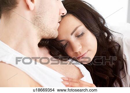 Close up of young woman asleep on boyfriends shoulder View Large Photo Image Picture - Close up of young woman asleep on boyfriends shoulder. Fotosearch