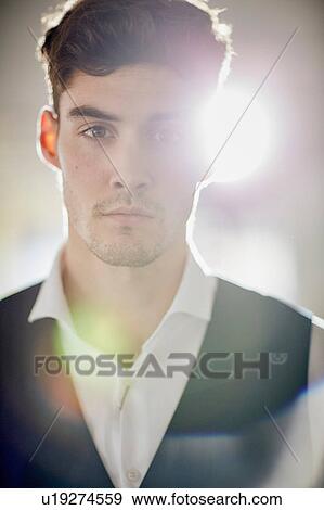 Stock Photo - Close up portrait of man wearing waist coat looking at camera. Fotosearch