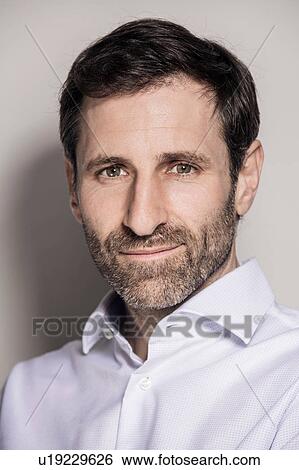 Close up studio portrait of confident bearded businessman View Large Photo Image Stock Photograph - Close up studio portrait of confident bearded businessman. Fotosearch