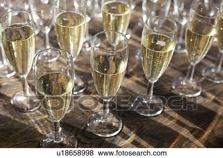 Collection of champagne in champagne flutes View Large Photo Image Stock Photo - Collection of champagne in champagne flutes. Fotosearch