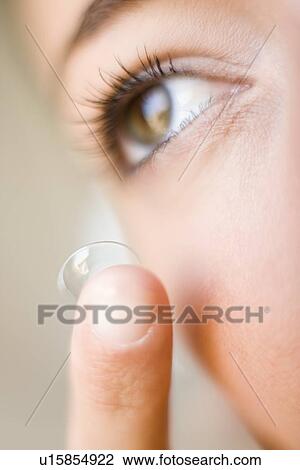 Stock Image - Contact lens use. Fotosearch