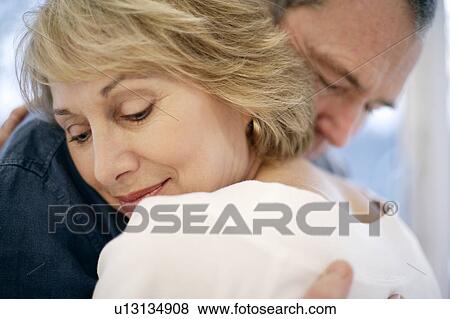 Stock Photo - Couple embracing. Fotosearch