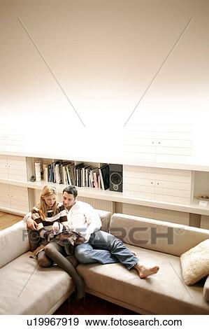 Stock Photo - Couple reading. Fotosearch