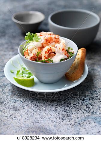 Crayfish cocktail with rocket, lime wedge and crusty baguette slice View Large Photo Image Picture - Crayfish cocktail with rocket, lime wedge and crusty baguette slice. Fotosearch