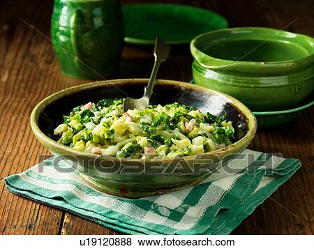 Stock Photo - Creamed greens with smoked bacon and cheddar cheese sauce, in bowl. Fotosearch