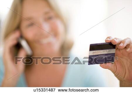 Stock Photo - Credit card purchasing. Fotosearch