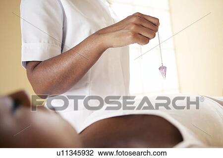 Stock Image - Crystal therapy. Fotosearch