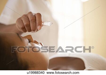 Stock Image - Crystal therapy. Fotosearch