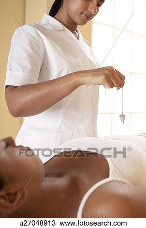 Stock Image - Crystal therapy. Fotosearch