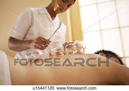 Stock Image - Cupping. Fotosearch