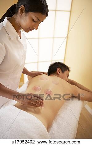Stock Image - Cupping. Fotosearch