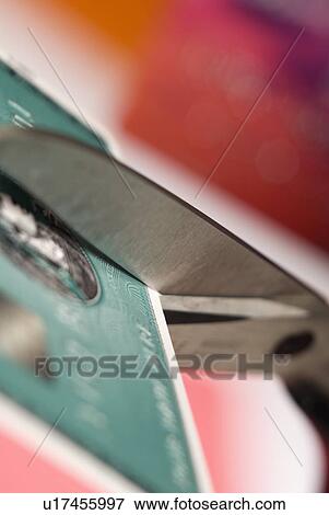 Cutting up a credit card View Large Photo Image Stock Photo - Cutting up a credit card. Fotosearch