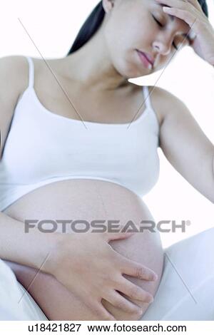 Stock Photo - Depressed pregnant woman. Fotosearch