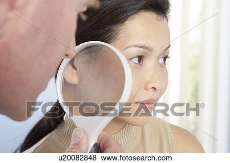 Stock Photo - Dermatological examination. Fotosearch