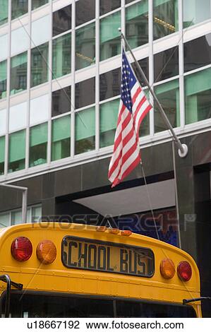 Detail of school bus outside office with American flag, New York, USA View Large Photo Image Stock Image - Detail of school bus outside office with American flag, New York, USA. Fotosearch