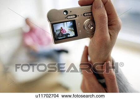Picture - Digital camera use. Fotosearch