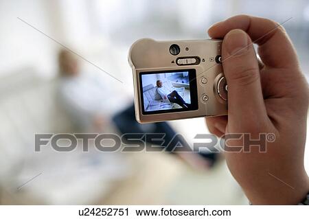 Stock Image - Digital camera use. Fotosearch